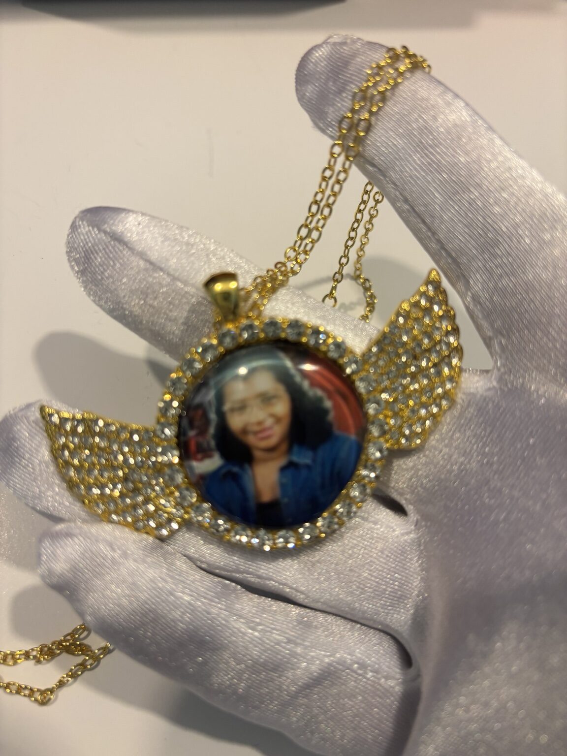 Gold angel-wing memorial photo pendant