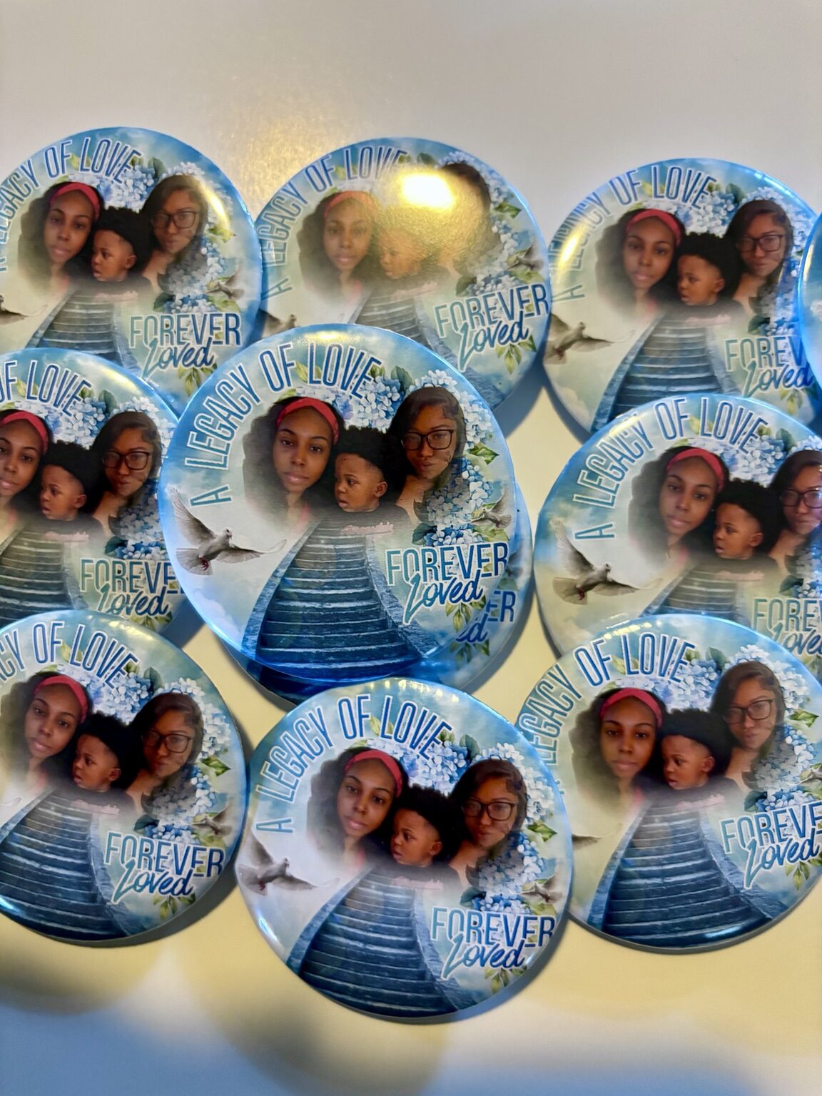 Collection of custom blue memorial photo buttons