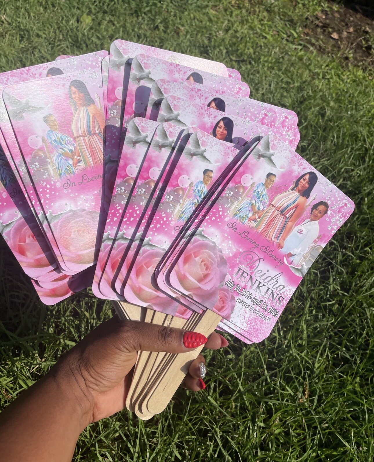 Collection of custom pink memorial fans
