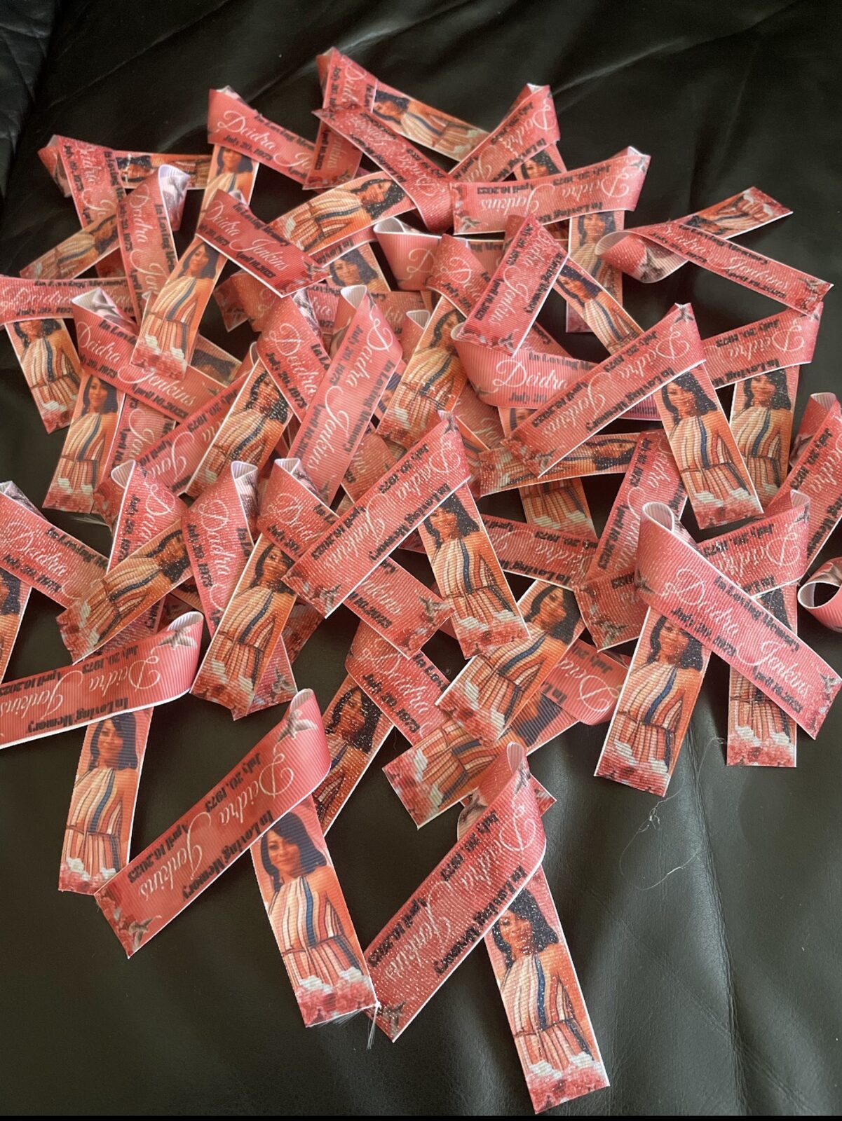 Collection of personalized red memorial ribbons