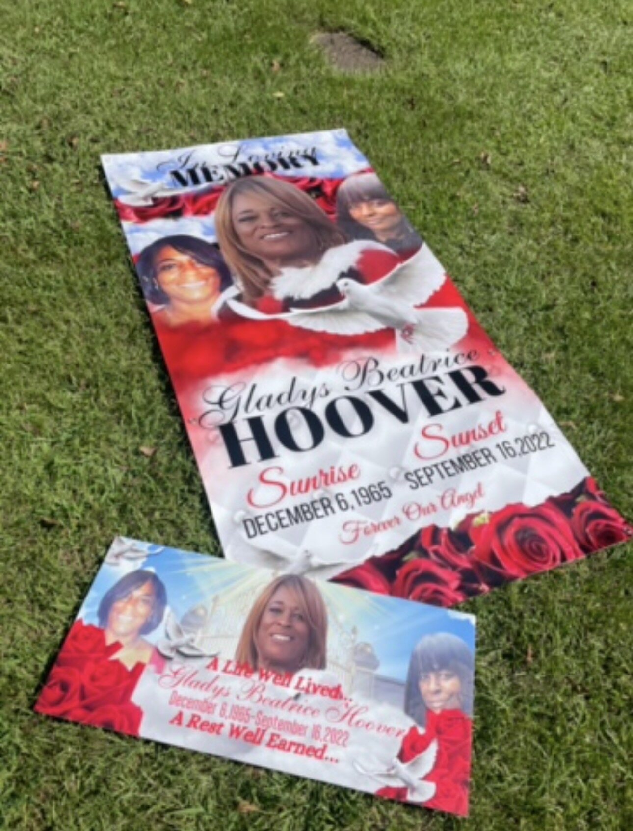 Red and white personalized memorial grave cover with matching tribute sign